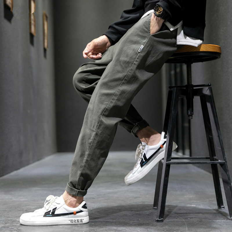 Men's olive relaxed tapered pants – seated view