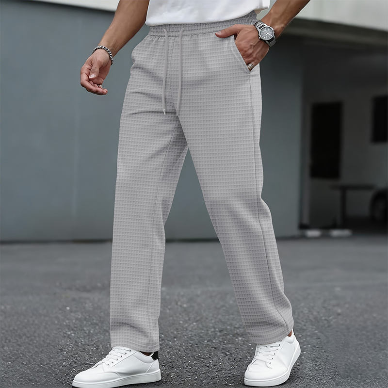 Gray men's waffle-knit drawstring casual pants – styled front view